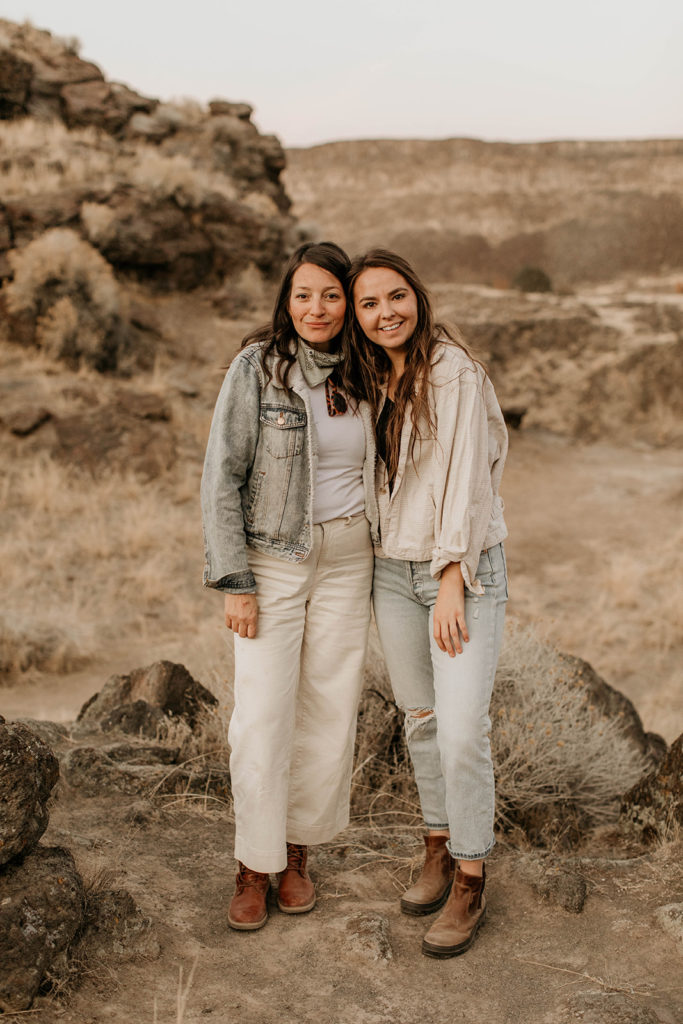 Morgan Wirth and her mom smile together while standing in a desert for a photography workshop.