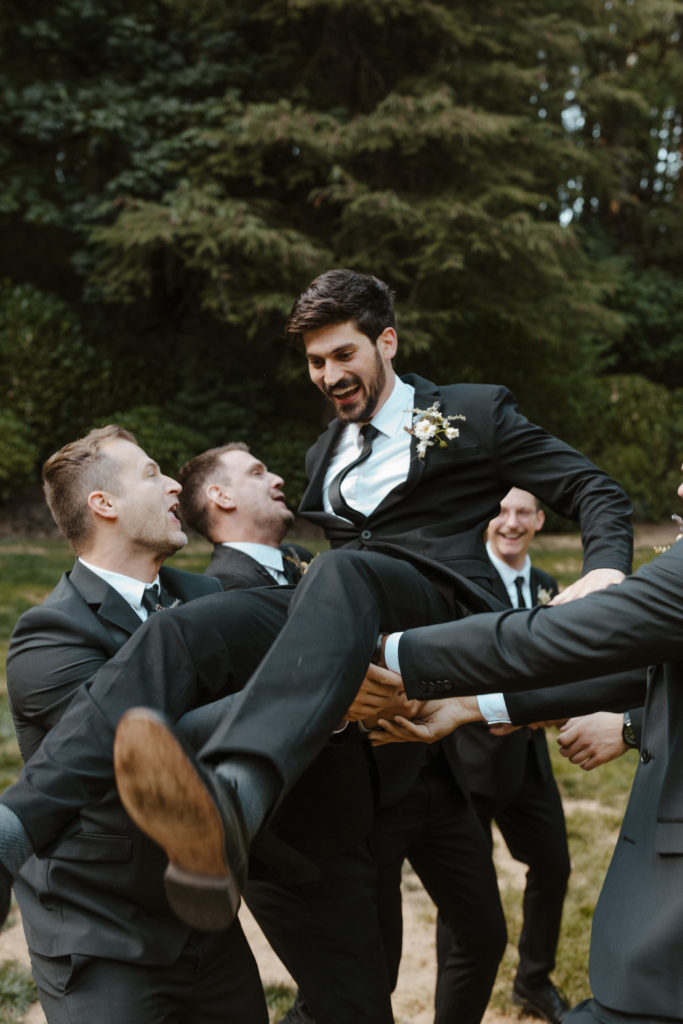 throwing the groom up in the air