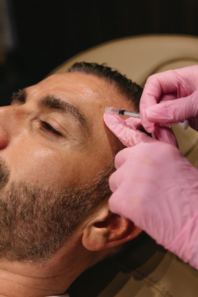 Injectables service during a branding session at a Dallas med spa.