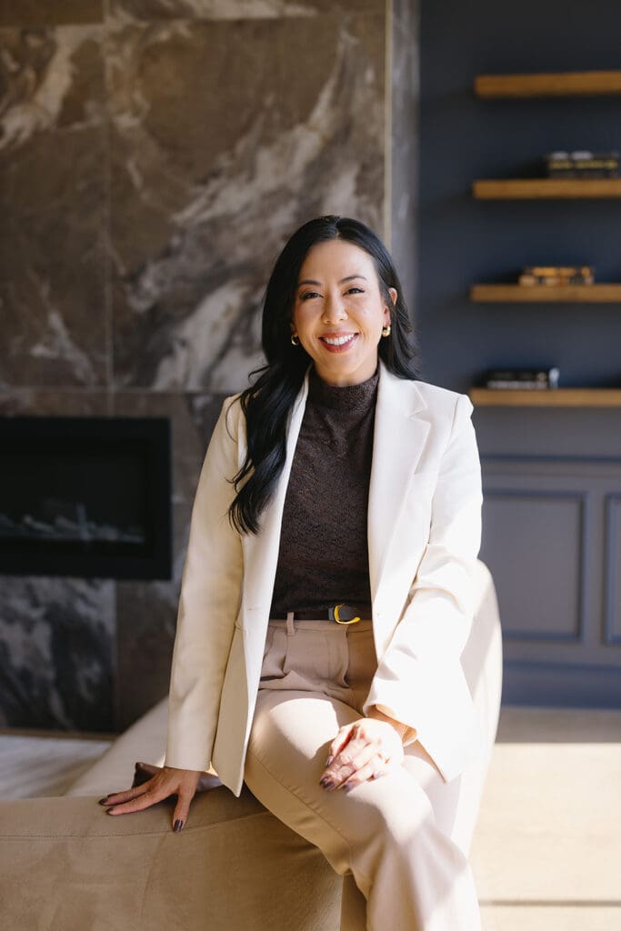 Lifestyle branding photo of woman walking through luxury Dallas med spa interior.