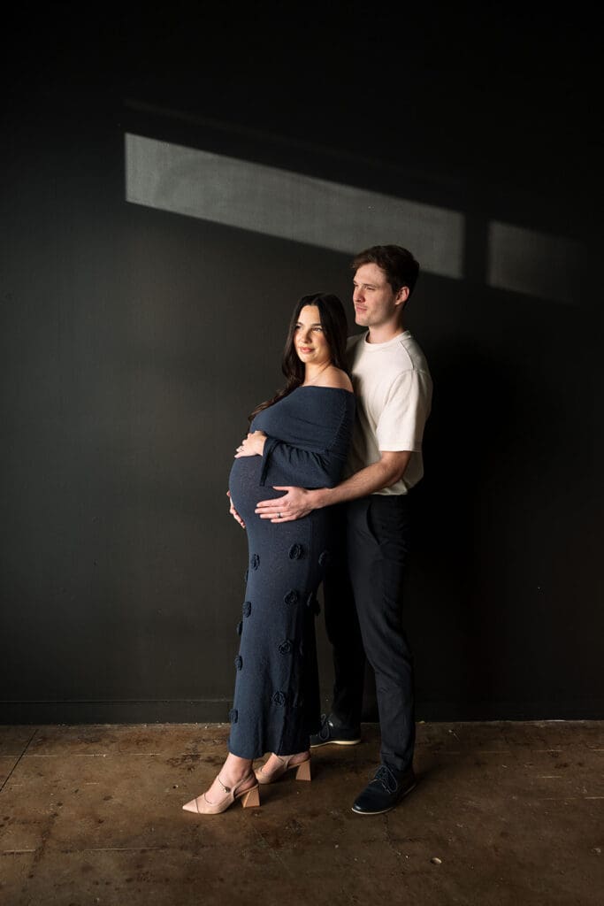 Maternity photoshoot with timeless editorial style and soft window lighting in Dallas.