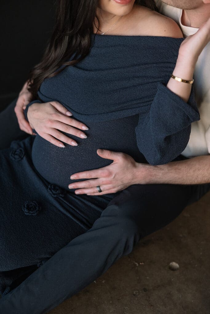 Editorial maternity portraits with warm light and natural posing at a Dallas studio.