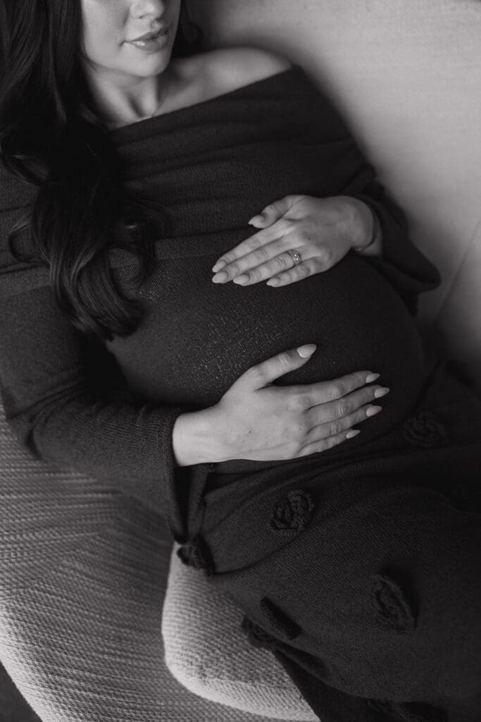 Expecting parents sharing a quiet, intimate moment during their maternity photoshoot in Dallas.