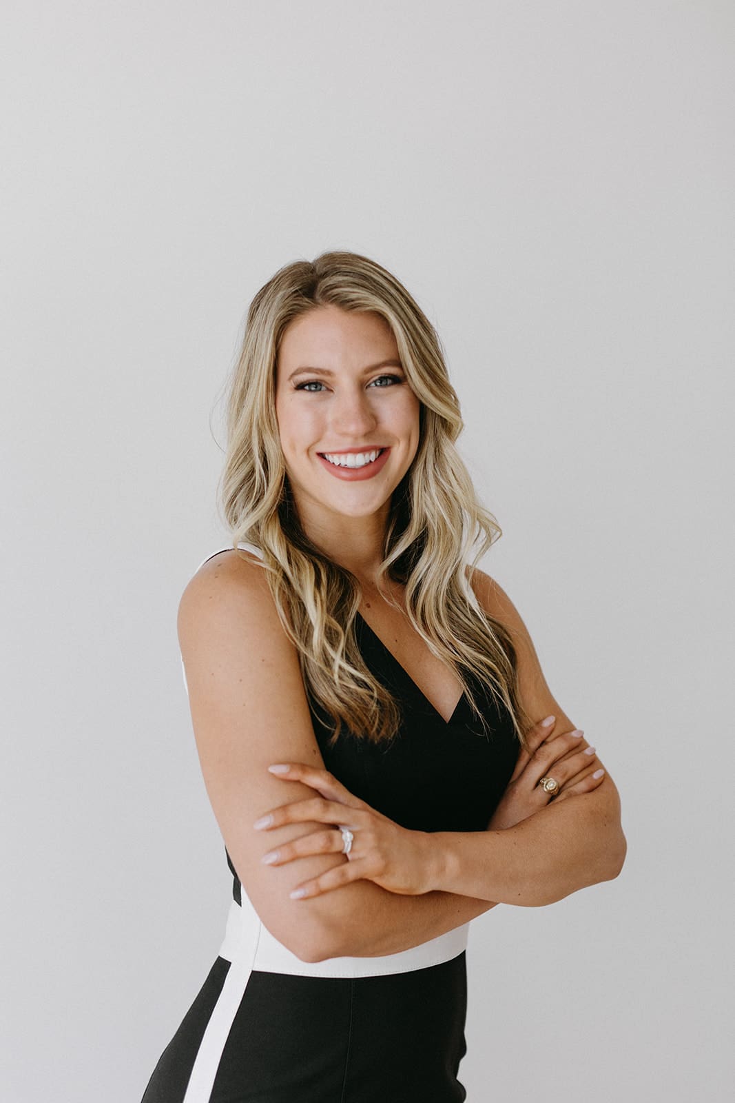 Fort Worth studio headshot of woman smiling against clean white background
